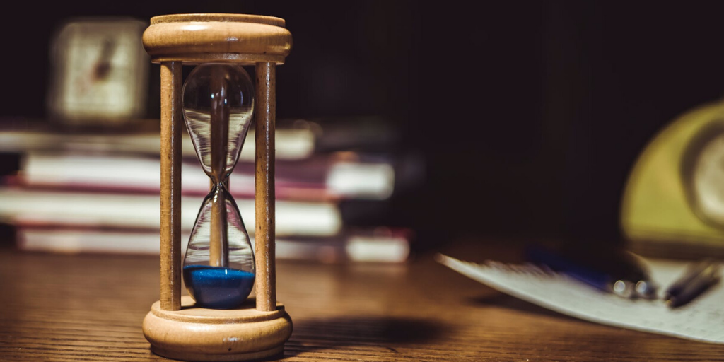 An hourglass has run out of time on a table