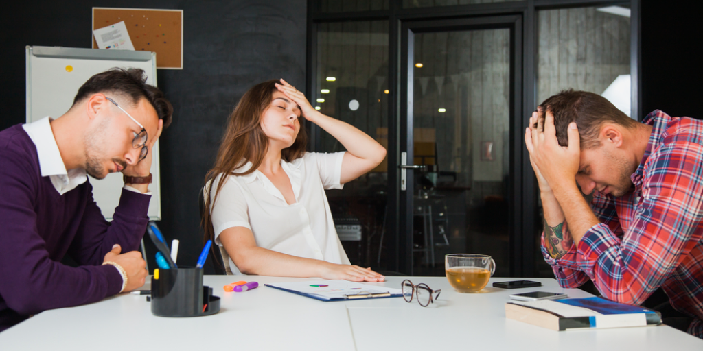 A disappointed group of office workers.