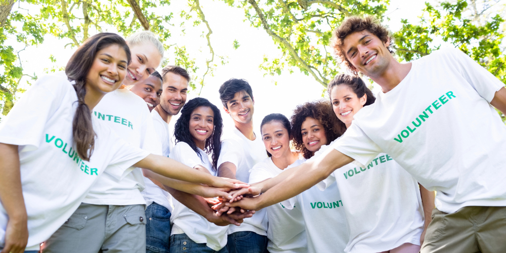 A group of young people preparing to volunteer in a park