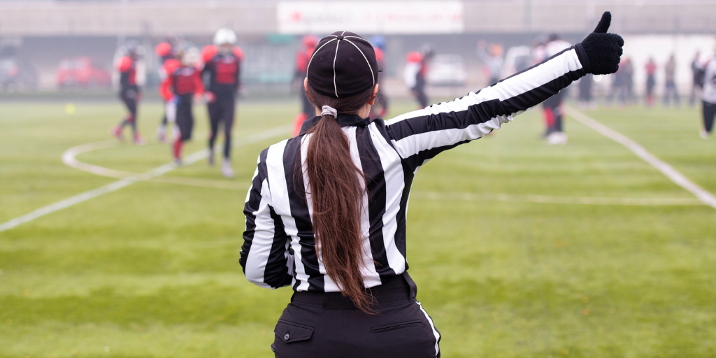 A female referee during a soccer game